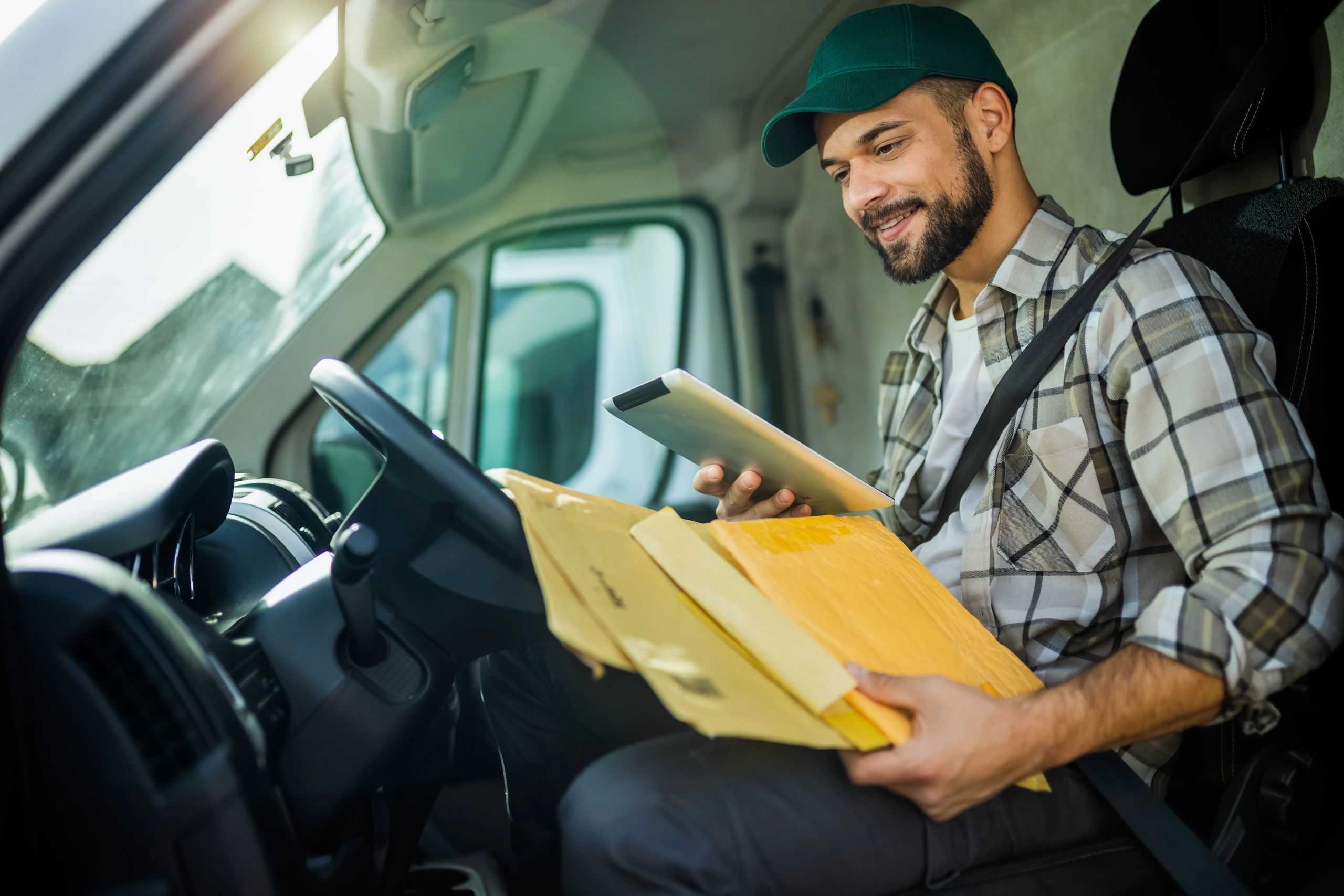 Professional delivery driver in van cab